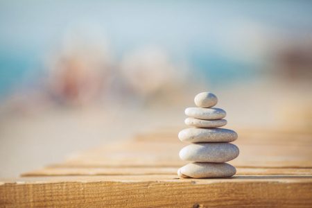 27193113 - zen stones jy wooden banch on the beach near sea  outdoor